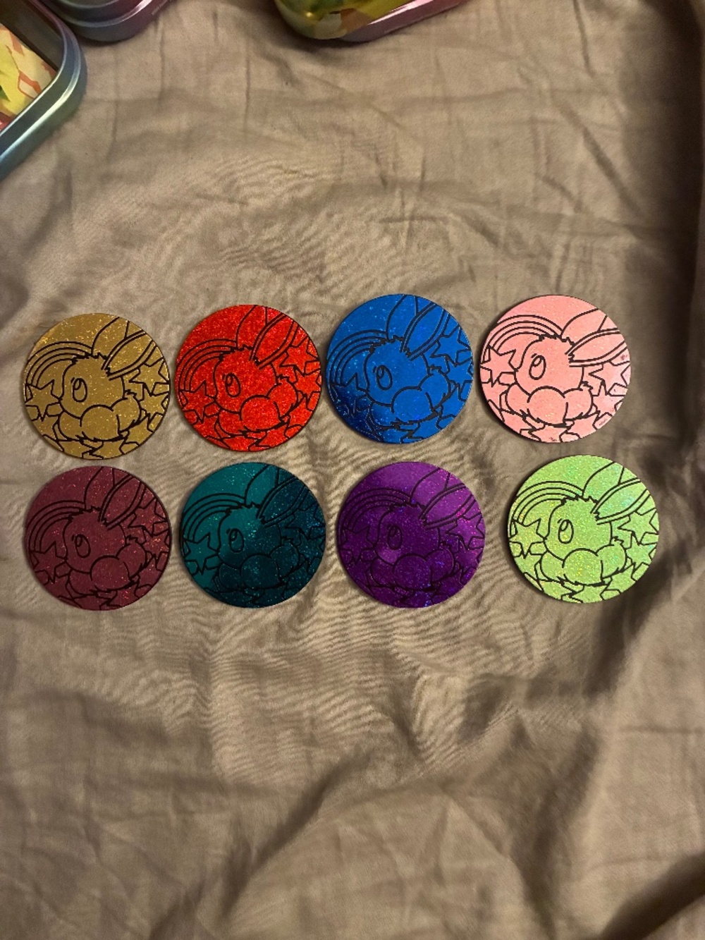 All eight prismatic evolutions Pokémon coins